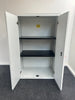 Metal double door cupboard with a white wood top